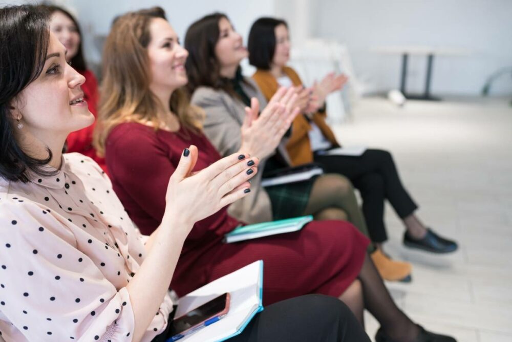 /women-in-business-seminar-audience-clapping.jpg